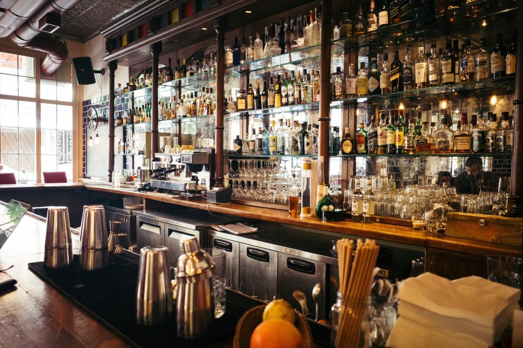 Spice Up Your Bar with Glass Shelving and Mirrors