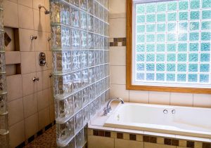 bathroom with frameless shower glass