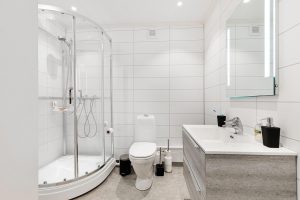 white bathroom with frameless shower glass in Toronto home